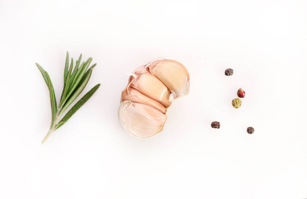 Garlic and rosemary on white background. Flat lay - Foto, immagini