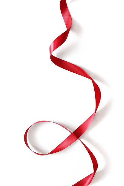 Shiny red satin ribbon isolated on white background - Foto, Imagen