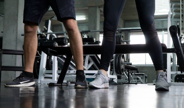 Low section on legs of people standing during an exercise class in a gym. Healthy sports lifestyle, Fitness concept. with copy space for your text. - Foto, Imagen