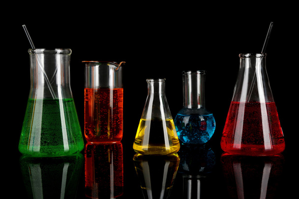Test tubes with colorful liquids on dark grey background - Φωτογραφία, εικόνα