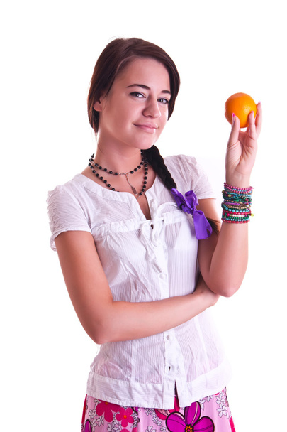 A woman in shirt with an orange - Φωτογραφία, εικόνα