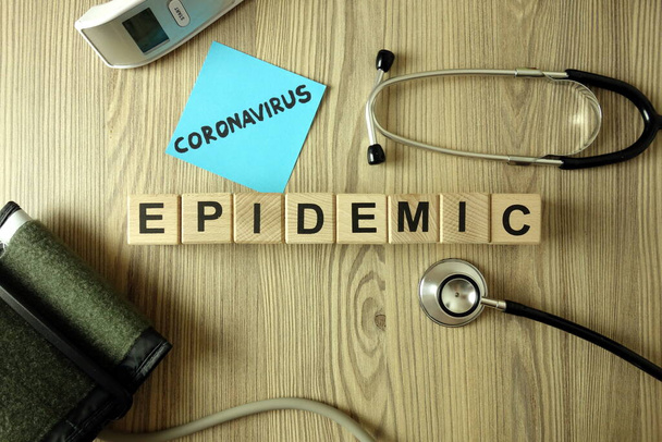 Text coronavirus epidemic with medical accessories, healthcare concept - Photo, Image