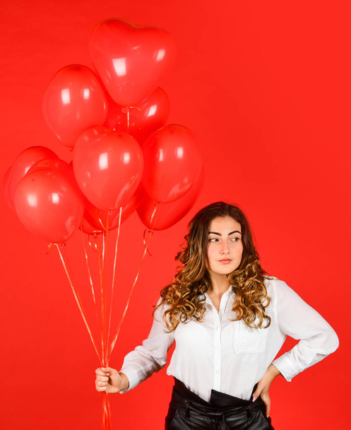 Happy valentines day. Girl heart balloons. Romantic love. Happy woman air balloons bunch gift. Surprise with love. Helium balloons for party. Gift for girlfriend. Festive mood. Impressive present - Φωτογραφία, εικόνα