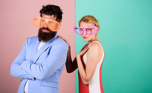 Photo booth props. party fun. couple in love. hipster guy and girl party glasses. friendship. lets celebrate together. Office party. Best friends relations. bearded man with pretty woman - Foto, Imagen
