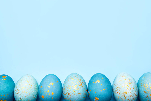 Easter frame of eggs painted in blue color. - Photo, image