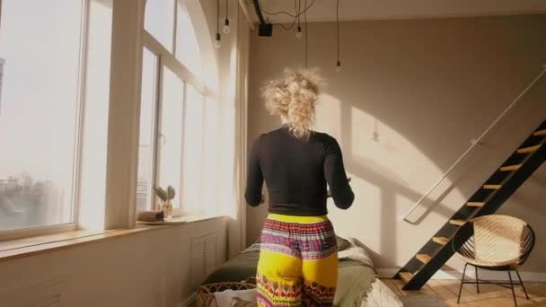 woman with tablet at home. Watching goods in an online store - Materiał filmowy, wideo
