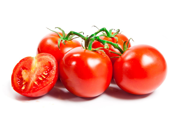 Closeup of tomatoes on the vine isolated on white - Φωτογραφία, εικόνα