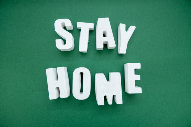 Stay Home appeal volumetric concrete Letters isolated on a plain one color Background - Foto, afbeelding