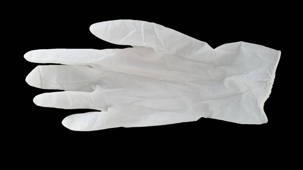luvas descartáveis brancas em um fundo preto
 - Foto, Imagem