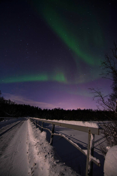 An aurora borealis, sometimes referred to as polar lights or northern lights, is a natural light display in the Earth's sky, predominantly seen in the high-latitude regions. - Photo, Image