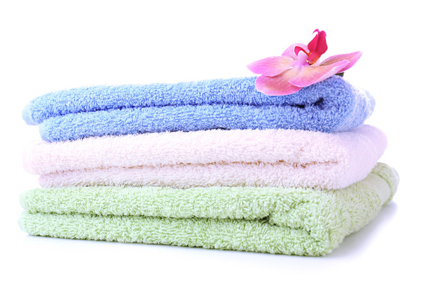 Orchid flower and towels, isolated on white - Φωτογραφία, εικόνα
