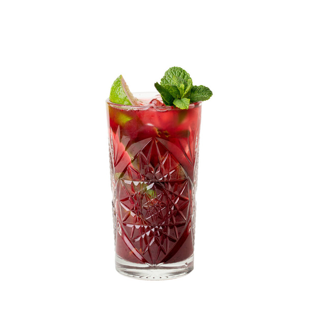Cold multi fruit cocktail drink with slices of lime, mint leaf isolation on a white - Φωτογραφία, εικόνα