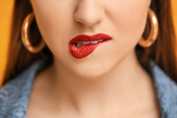 Beautiful young woman with bright lips, closeup - Fotó, kép