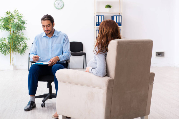 Pregnant woman visiting young male psychologist - Photo, Image