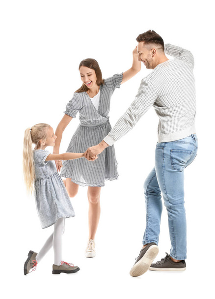 Happy family dancing against white background - Φωτογραφία, εικόνα