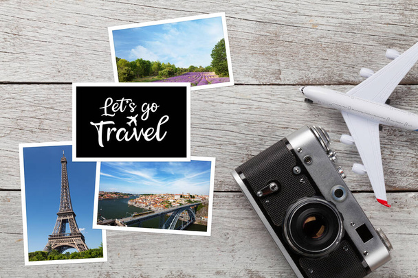 Travel concept with vacation photos, airplane toy and camera on wooden table. Top view flat lay with copy space - Photo, Image
