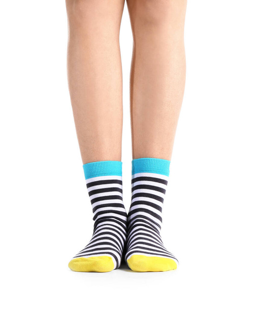 Legs of young woman in socks on white background - Photo, Image