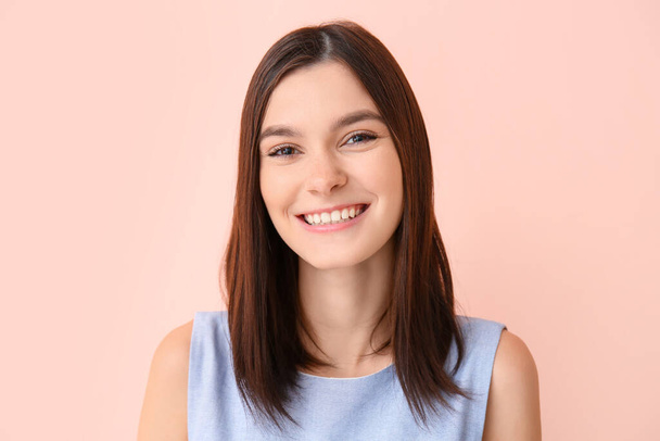 Portrait of beautiful young woman on color background - Photo, image