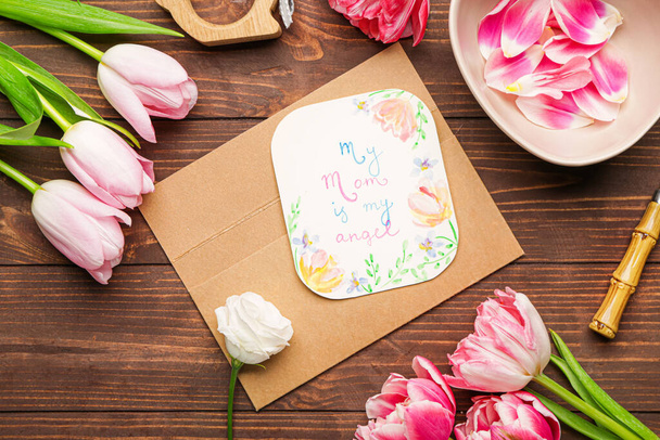 Composition with greeting card for mother on wooden background - Foto, Imagem