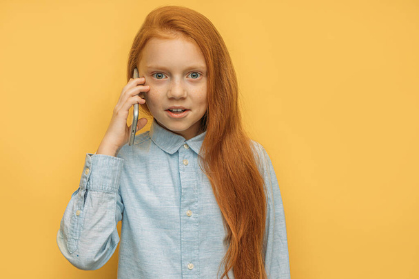 awesome caucasian red haired girl talking on phone - Fotografie, Obrázek