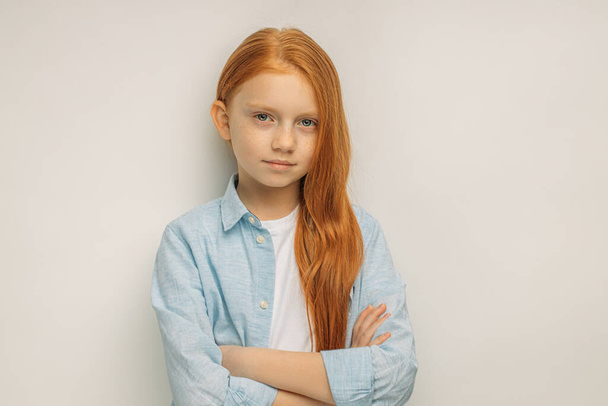 portrait of serious caucasian girl with red hair, isolated - Foto, immagini