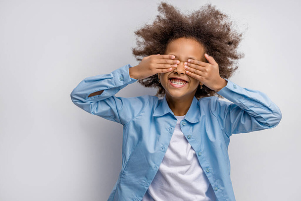 portrait of positive smiling child with closed eyes - Photo, Image