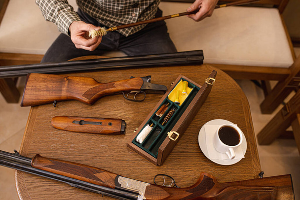 top view on rifle objects on table - 写真・画像