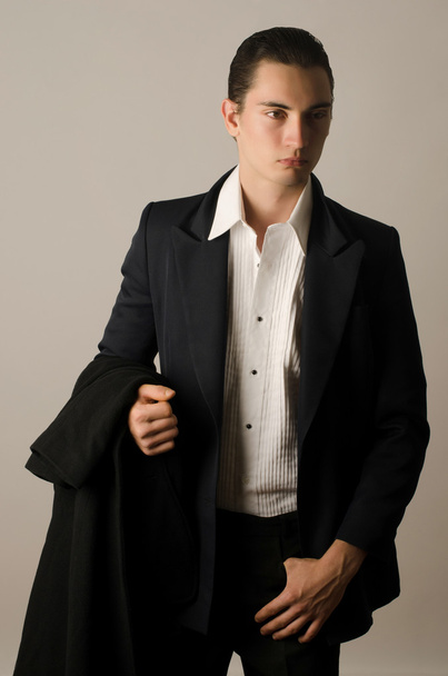 Young businessman in long coat - 写真・画像