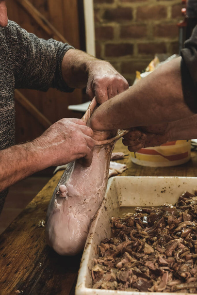 Hands making homemade head cheese, Patagonia, Argentinië - Foto, afbeelding