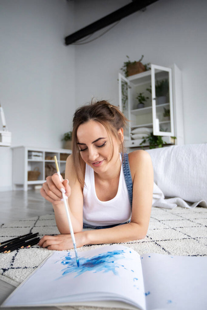 Woman drawing watercolor design. Inspiration art creation, hobby - Zdjęcie, obraz