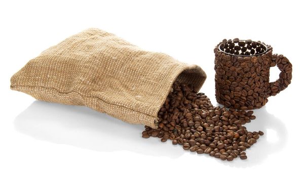Cup of coffee beans and a bag of coffee isolated on white background. - Photo, image