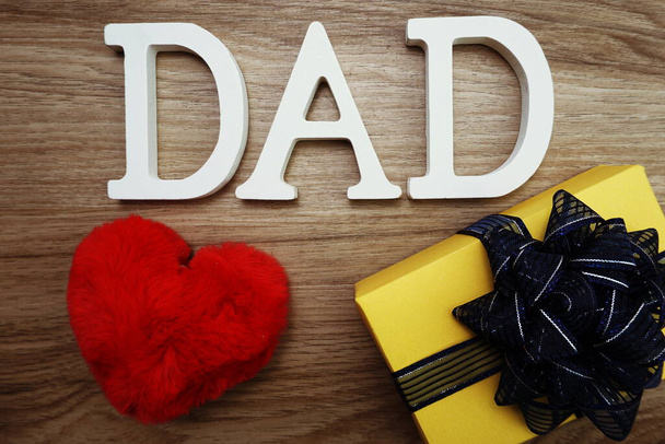 Happy Father's Day concept with DAD alphabet letter with space copy on wooden background - Фото, зображення