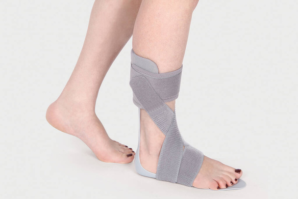 Orthopedic Ankle Brace. Medical Ankle Bandage. Medical Ankle Support Strap Adjustable Wrap Bandage Brace foot Pain Relief Sport. Leg Brace isolated on white background - Zdjęcie, obraz