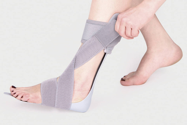 Orthopedic Ankle Brace. Medical Ankle Bandage. Medical Ankle Support Strap Adjustable Wrap Bandage Brace foot Pain Relief Sport. Leg Brace isolated on white background - Foto, imagen