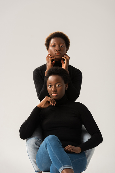 thoughtful african american women in black turtlenecks isolated on grey - Foto, Imagem