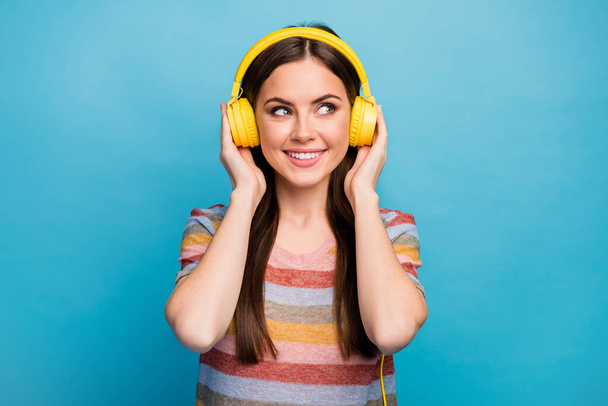 Close-up portrait of nice lovely charming cute winsome feminine dreamy cheerful girl music lover listening radio isolated on bright vivid shine vibrant blue color background - Photo, Image