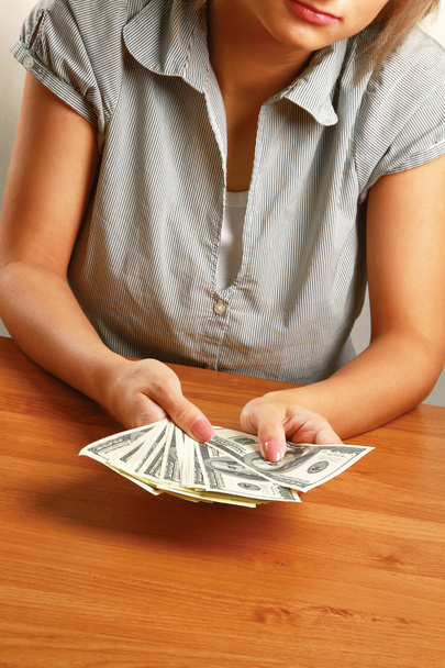A young woman holding dollars - Photo, Image