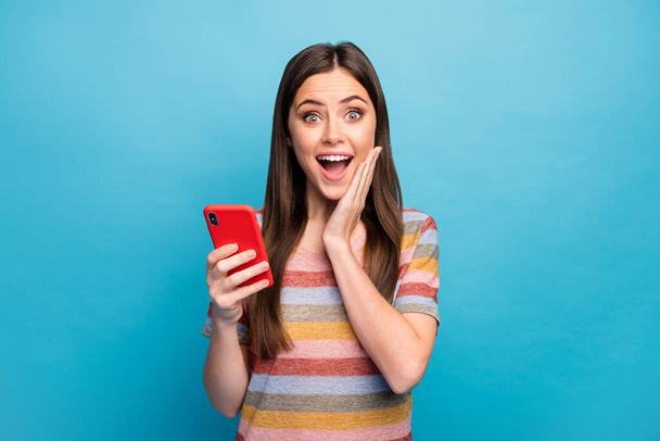 Close-up portrait of her she nice lovely pretty amazed cheerful cheery girl browsing app web service online shopping isolated over bright vivid shine vibrant blue color background - Fotografie, Obrázek