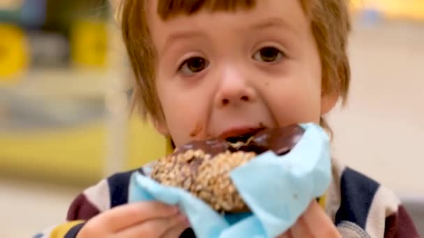Little boy enjoying chocolate dessert - Video, Çekim