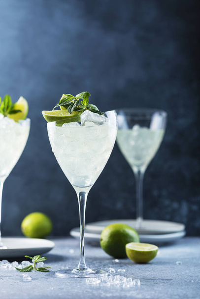 Summer cocktail mojito with rum, lime and mint, selective focus image - 写真・画像