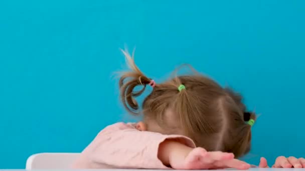 Beautiful little girl hiding in studio - Filmati, video