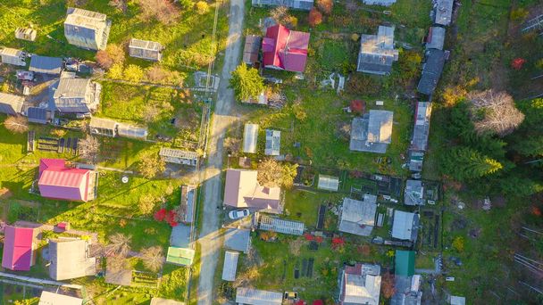 Holiday village in the suburbs of the city of Ekaterinburg. Ural, Russia. Autumn, sunset time, Aerial View, HEAD OVER SHOT   - Fotoğraf, Görsel