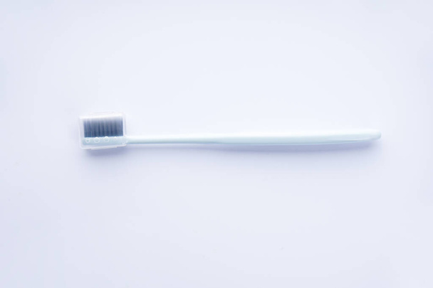 Blue toothbrush in a case on a white background. Isolated. - Фото, изображение