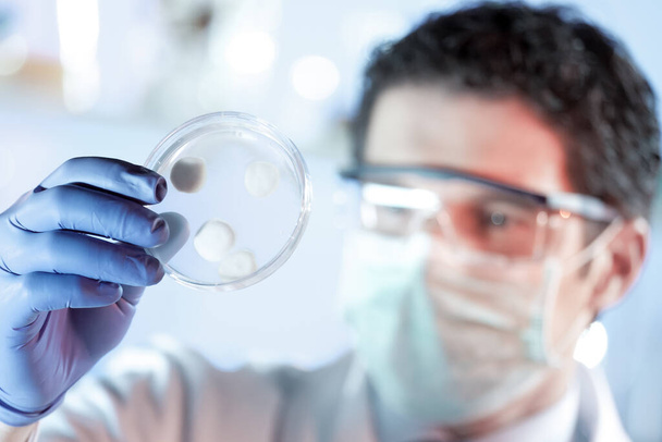 Scientist working in corona virus vaccine development laboratory research facility. - Photo, Image