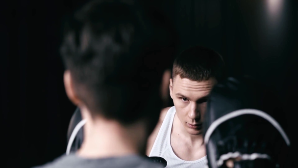 Slow-motion of sportsman boxing with trainer  - Materiał filmowy, wideo