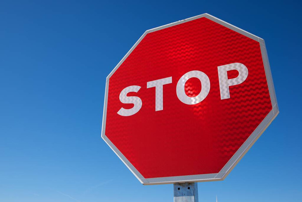 Stop traffic sign with clear blue sky. - Photo, Image