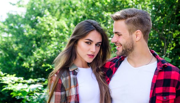 Happy together. Couple in love. Enjoying each other. Man hipster and pretty woman in love. Summer vacation. Fall in love. Pure feelings. Romantic date concept. Cuddling with darling. Beautiful people - Фото, изображение