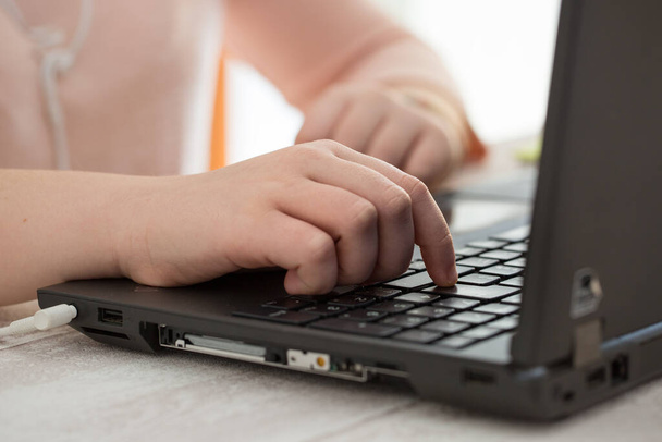 Detail of hand  typing on a laptop keyboard - Foto, Imagen