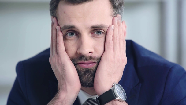 frustrated businessman looking at camera in office  - Felvétel, videó