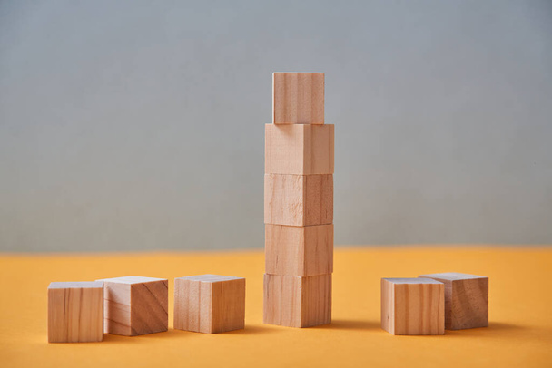 Tower of wooden cubes. Business mockup with copy space. Career growth and development. Blocks with empty place for text - Foto, imagen